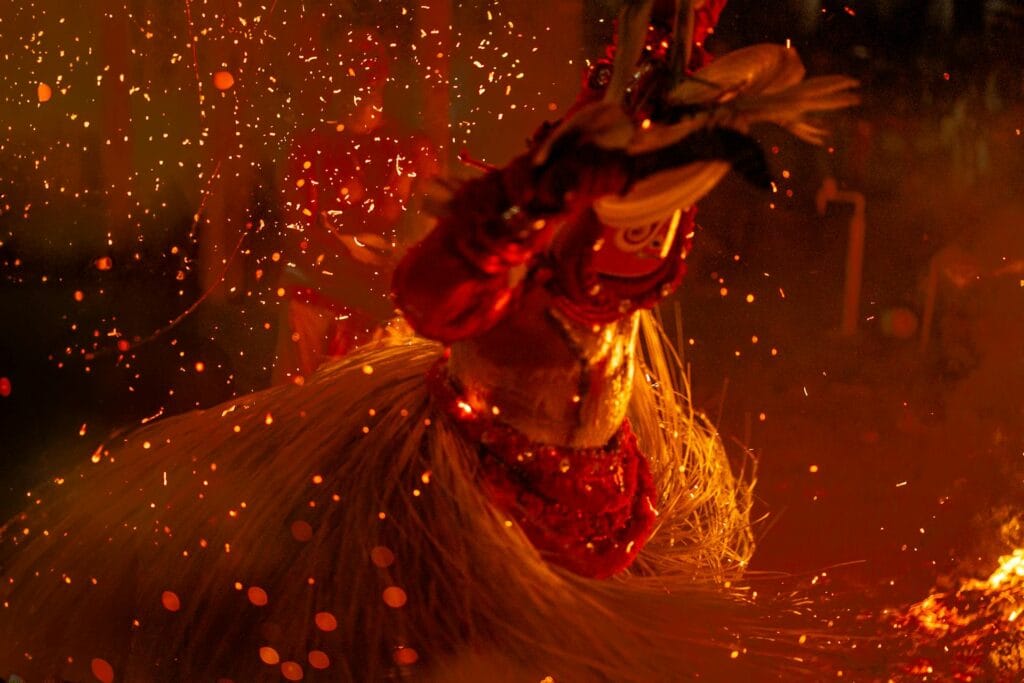 A row of upright matchsticks against a dark background
