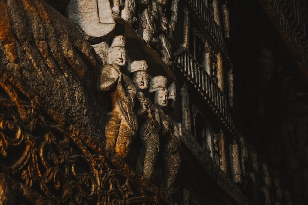 smiling buddha in rock carving