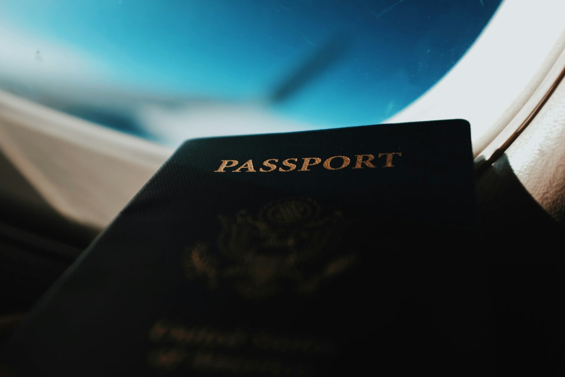 A passport and a plane window — the view from living abroad